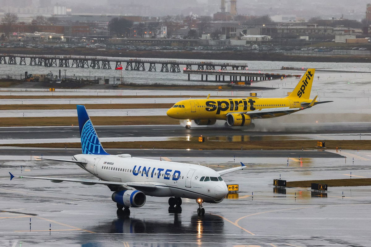 <i>Charly Triballeau/AFP/Getty Images via CNN Newsource</i><br/>JetBlue Airways is pulling out of its deal to purchase Spirit Airlines. United and Spirit airlines aircraft are pictured here at La Guardia Airport on January 9.