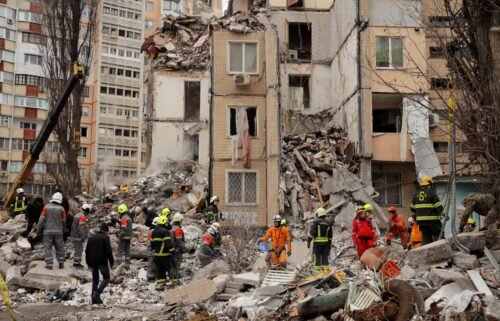 People visit the remnants of the building that was struck by a Russian drone in Odesa