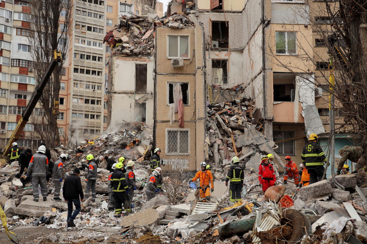 <i>Oleksandr Gimanov/AFP/Getty Images via CNN Newsource</i><br/>People visit the remnants of the building that was struck by a Russian drone in Odesa