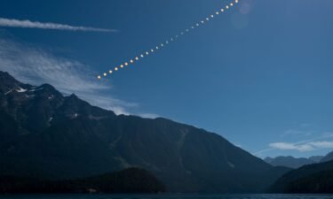 This composite image shows the progression of a partial solar eclipse over Ross Lake in Northern Cascades National Park in Washington on August 21