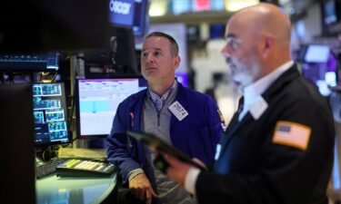 Traders work on the floor at the New York Stock Exchange on March 5. Stocks tumbled Tuesday with tech stocks leading the way