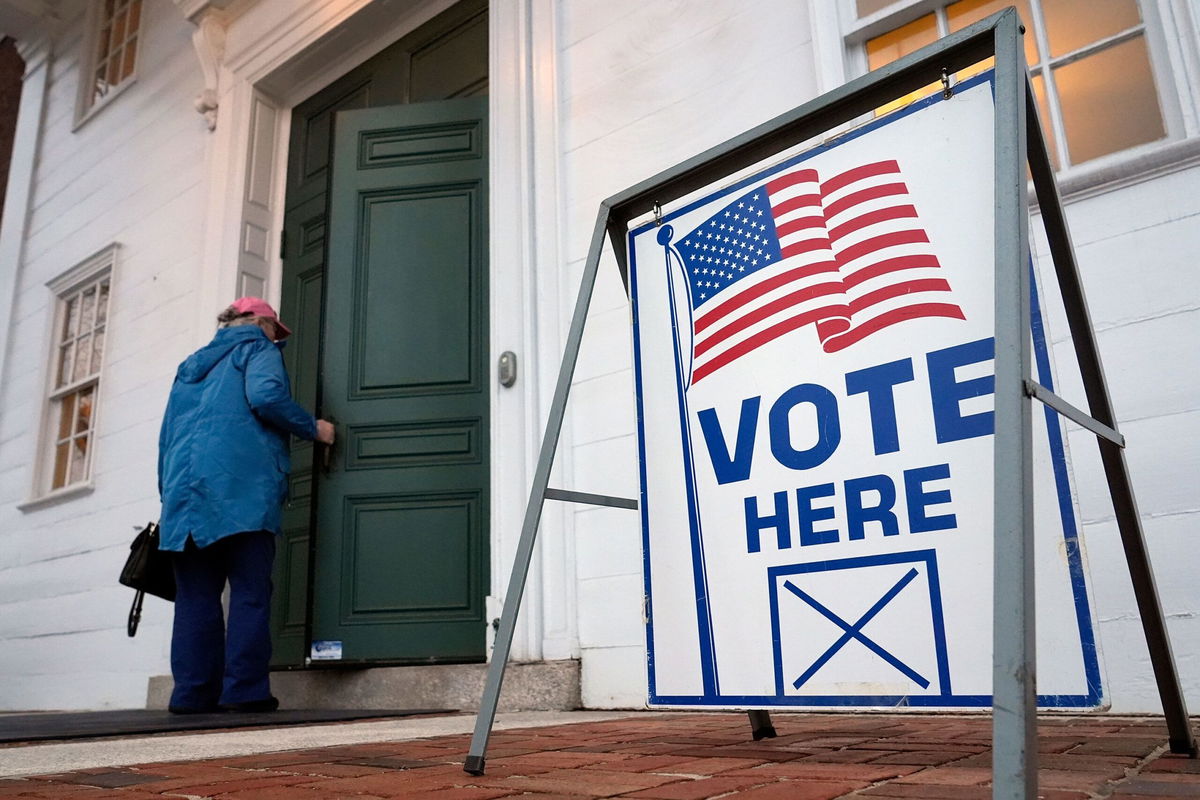 <i>Michael Dwyer/AP via CNN Newsource</i><br/>A voter enters the polling station in Kennebunk