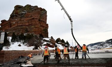 Construction workers pour concrete in the upper parking lot at Red Rocks Park and Amphitheatre on February 6