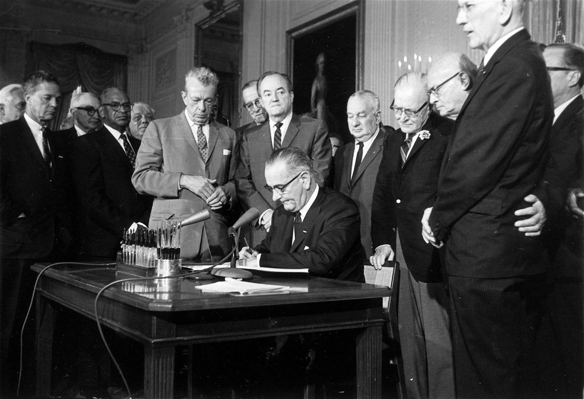 <i>AP via CNN Newsource</i><br/>President Lyndon Baines Johnson signs the Civil Rights Act on July 2