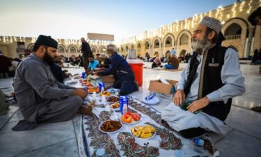Palestinians gather for iftar at tables set up in the streets of Khan Younis in Gaza