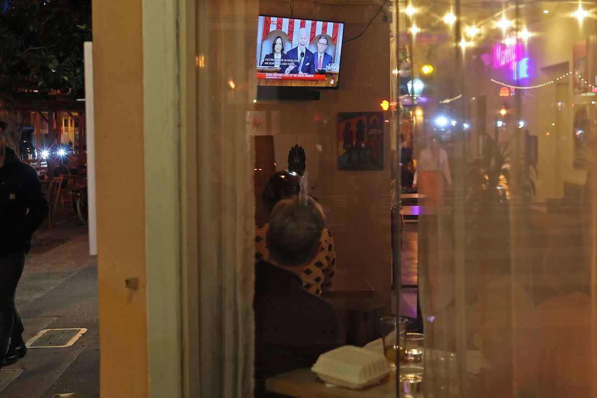 <i>Justin Sullivan/Getty Images via CNN Newsource</i><br/>People in San Francisco watch President Joe Biden deliver the State of the Union on March 7.