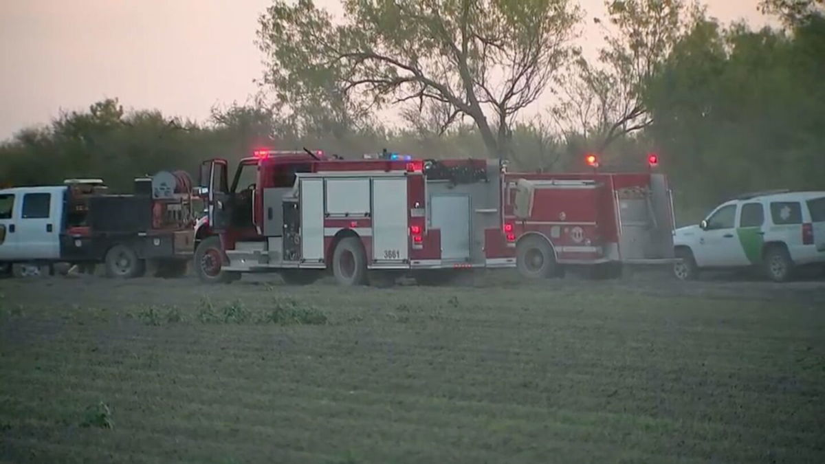 <i>KRGV via CNN Newsource</i><br/>Border Patrol and first responders on the scene of a helicopter crash in Starr County