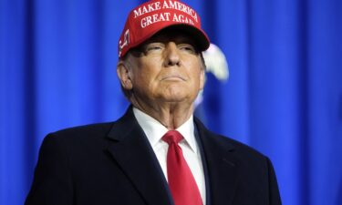 Republican presidential candidate and former President Donald Trump arrives for a campaign rally in Waterford Township