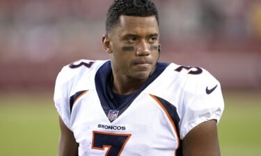 Russell Wilson looks on from the sideline during the Denver Broncos' preseason game against the San Francisco 49ers in 2023.
