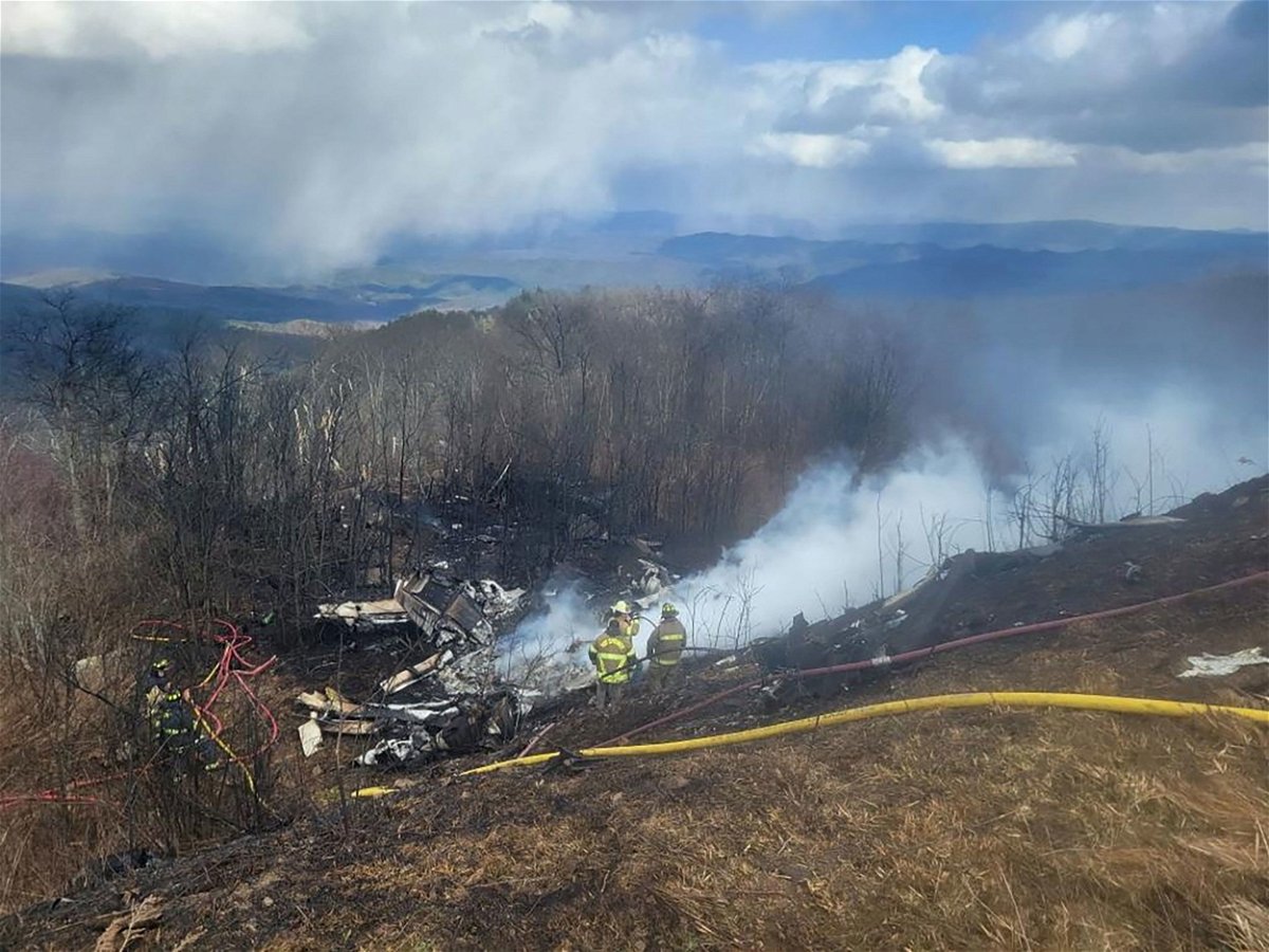<i>Austin Hall/The Recorder/Reuters via CNN Newsource</i><br/>An emergency crew works at the site of a plane crash in Hot Springs