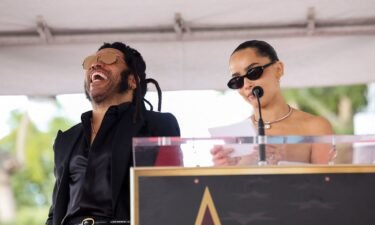 Lenny Kravitz reacts as Zoë Kravitz speaks during the unveiling ceremony of his star on the Hollywood Walk of Fame