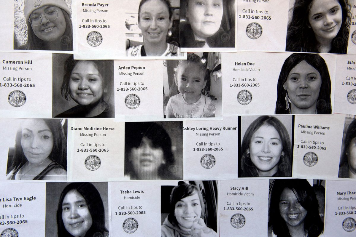 <i>Jason Connolly/AFP via Getty Images via CNN Newsource</i><br/>A poster displays the faces of missing or murdered indigenous persons during a student-led rally held by students from the American Indian Academy of Denver during Missing or Murdered Indigenous Persons Awareness Day on May 5