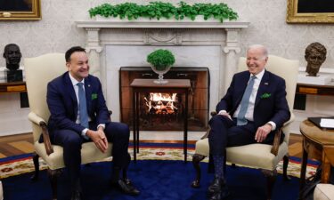 President Joe Biden and Irish Taoiseach Leo Varadkar speak to one another in the Oval Office of the White House on March 17