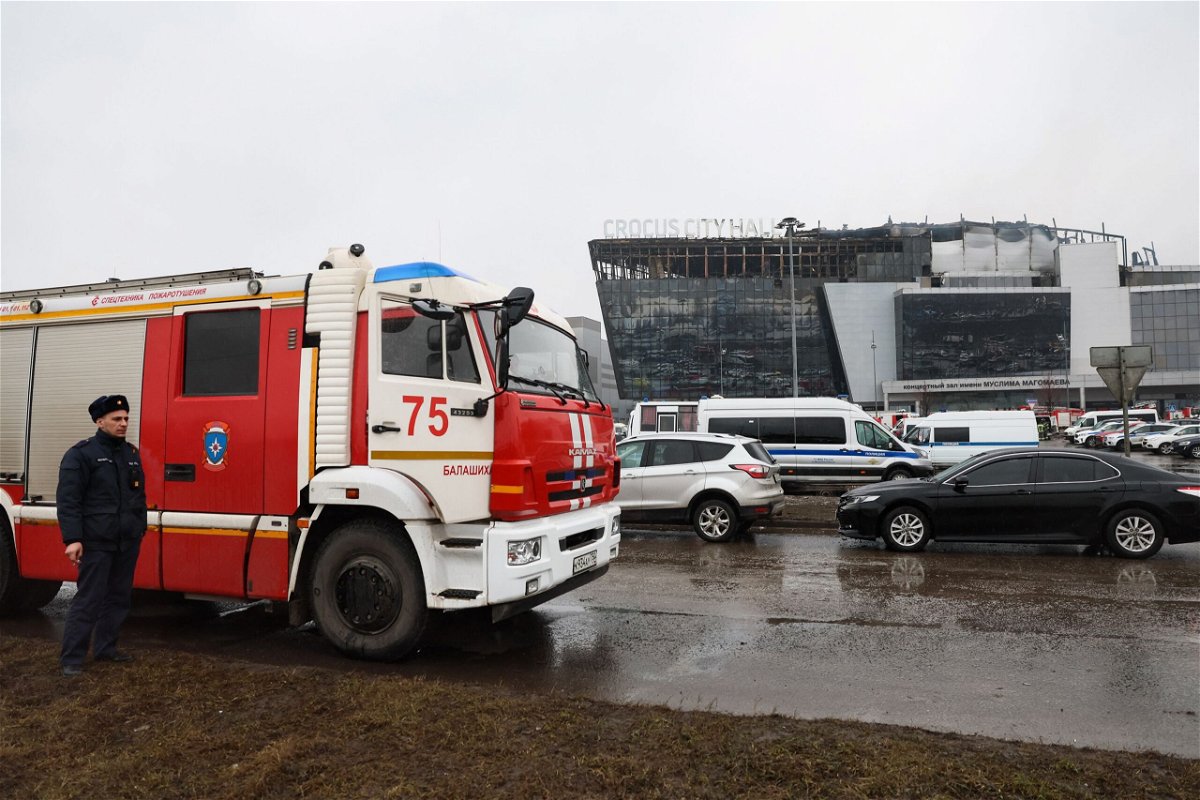 <i>Stringer/AFP/Getty Images via CNN Newsource</i><br/>Emergency services personnel and police work at the scene of the gun attack at the Crocus City Hall concert hall in Krasnogorsk on March 23.