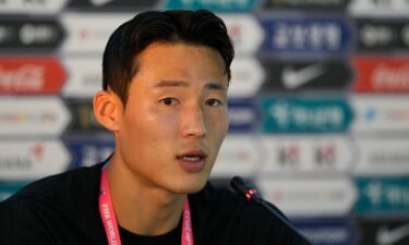 Son speaks at a press conference during the 2022 FIFA World Cup in Qatar.
