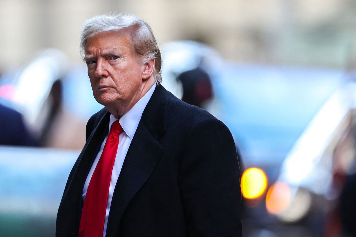 <i>Charly Triballeau/AFP/Getty Images via CNN Newsource</i><br/>Former US President Donald Trump arrives at 40 Wall Street after his court hearing to determine the date of his trial for allegedly covering up hush money payments in New York City on March 25.