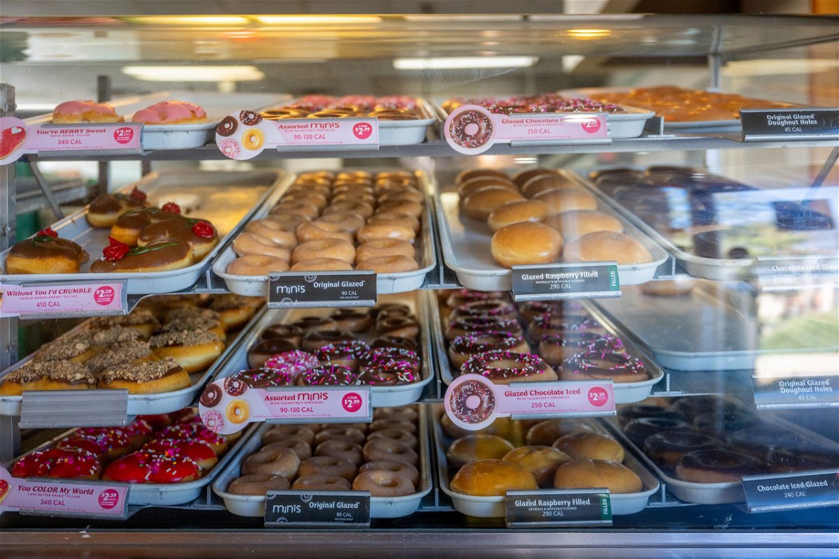 <i>Brandon Bell/Getty Images via CNN Newsource</i><br/>Doughnuts are displayed for sale at a Krispy Kreme store on February 13