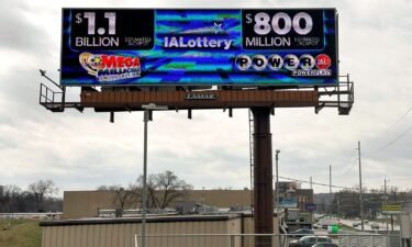 An electronic billboard advertises the Mega Millions and Powerball jackpots