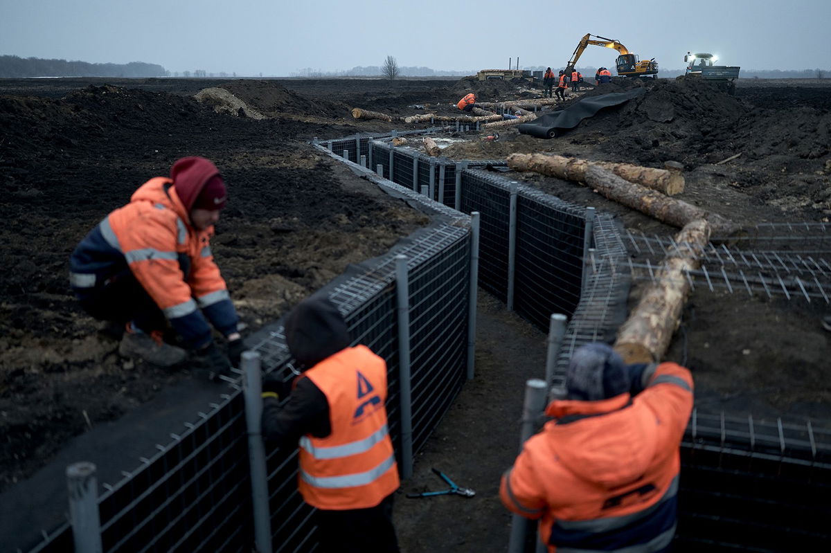 <i>Libkos/Getty Images via CNN Newsource</i><br/>Workers inspect fortifications being built in Ukraine's Sumy region on March 16. The city of Sumy