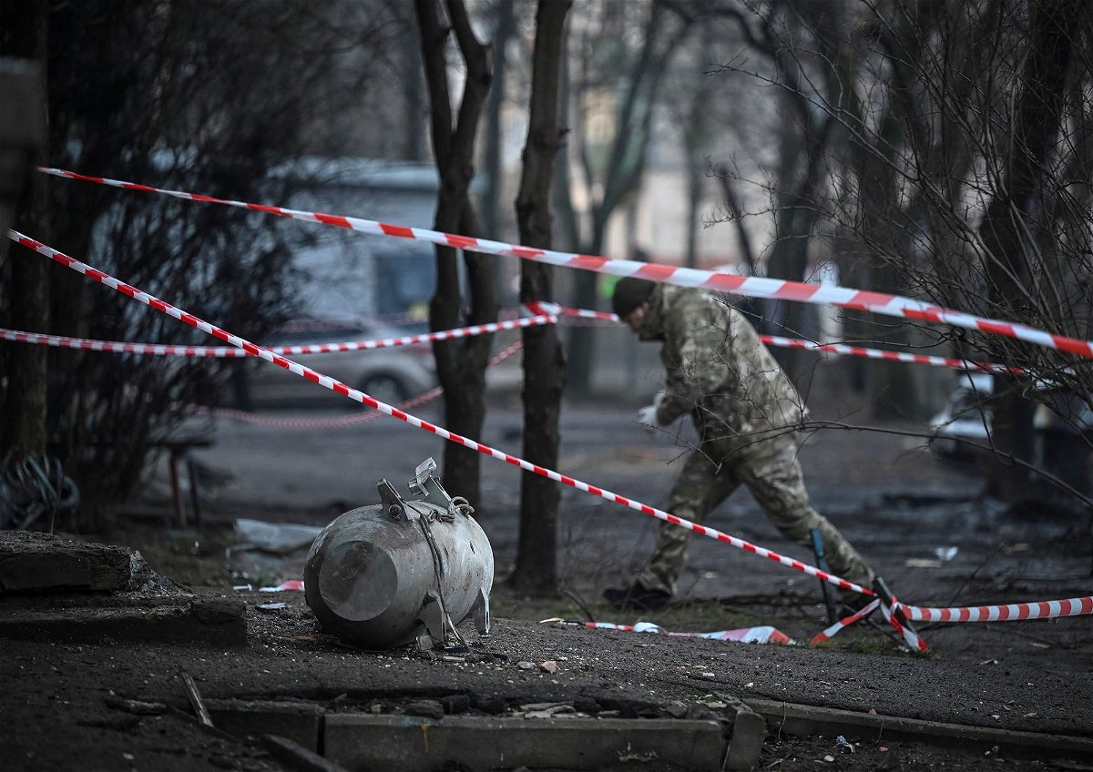 <i>Viacheslav Ratynskyi/Reuters via CNN Newsource</i><br/>A bomb squad member works next to a part of a missile after a Russian missile attack in Kyiv.