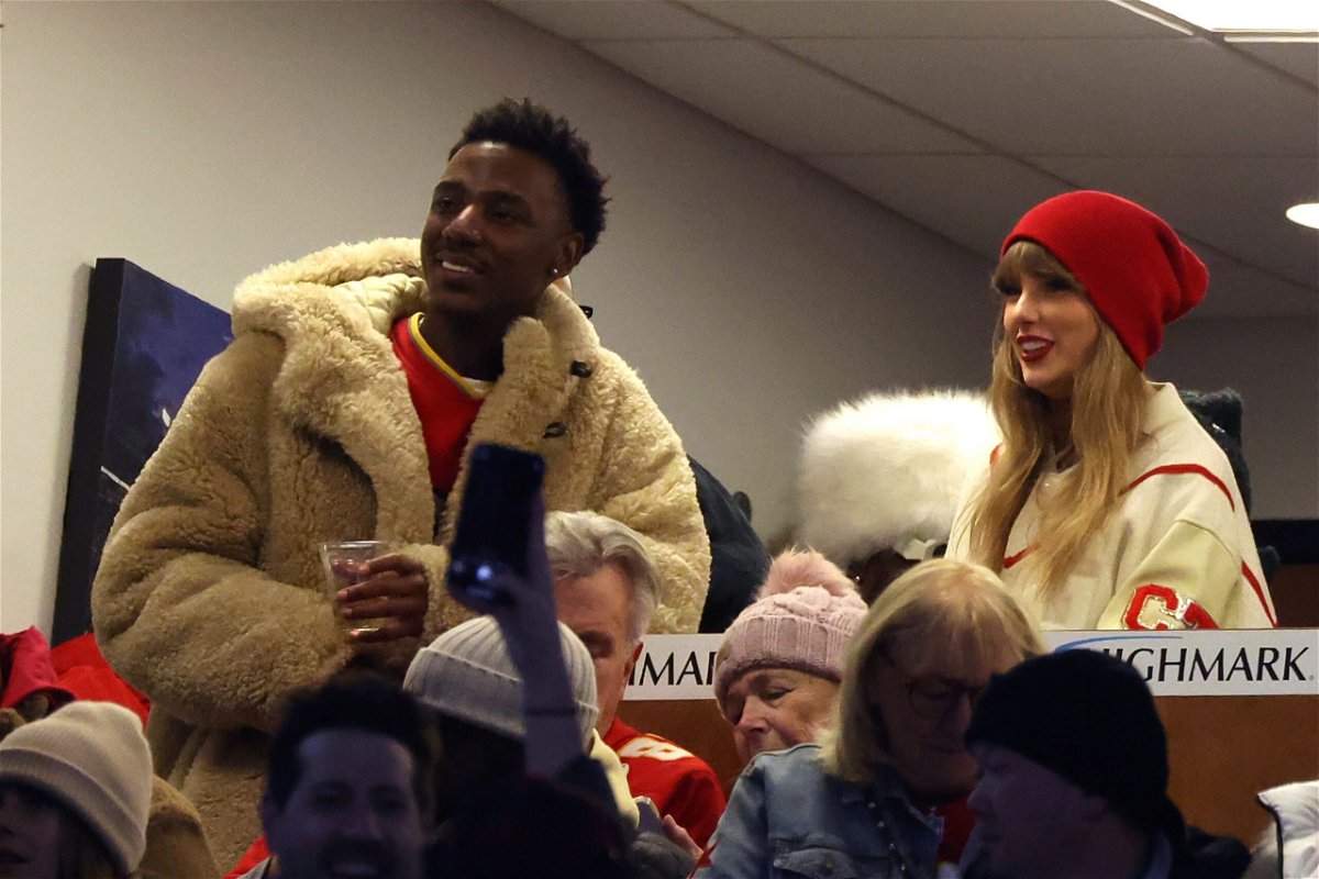<i>Al Bello/Getty Images via CNN Newsource</i><br/>Jerrod Carmichael and Taylor Swift at an NFL game in January.