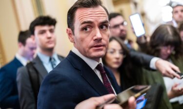 Rep. Mike Gallagher talks with reporters in the US Capitol on March 13. GOP Rep. Mike Gallagher of Wisconsin will resign from Congress early