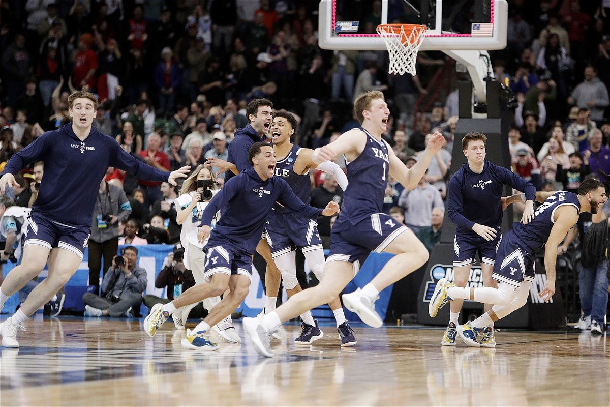 <i>Young Kwak/AP via CNN Newsource</i><br/>Yale players celebrate after their win over Auburn in the first round of the NCAA men's basketball tournament in Spokane