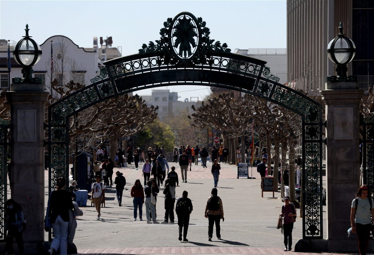 <i>Justin Sullivan/Getty Images via CNN Newsource</i><br/>People walk through Sproul Plaza on the UC Berkeley campus on March 14