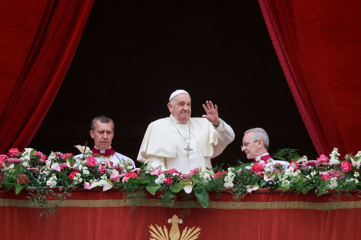 <i>Yara Nardi/Reuters via CNN Newsource</i><br/>Pope Francis waves from a balcony on Easter Sunday. Francis called for an 