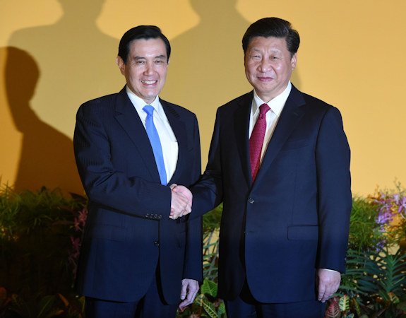 Chinese leader Xi Jinping shakes hands with then Taiwan President Ma Ying-jeou before their meeting in Singapore on November 7, 2015.