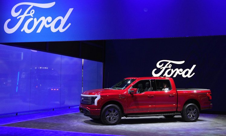 Ford unveils the new F-150 Lightning electric pickup during a Los Angeles auto show in November. Ford’s electric vehicle unit reported that losses soared in the first quarter to $1.3 billion, or $132,000 for each of the 10,000 vehicles it sold in the first three months of the year, helping to drag down earnings for the company overall.