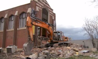 A historic building in Salt Lake City has become the focal point of controversy as demolition commenced on Easter morning