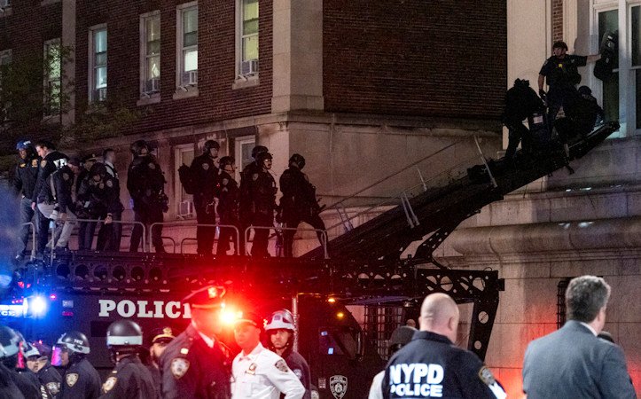 Using a tactical vehicle, New York City police enter an upper floor of Hamilton Hall on the Columbia University campus in New York Tuesday night.
