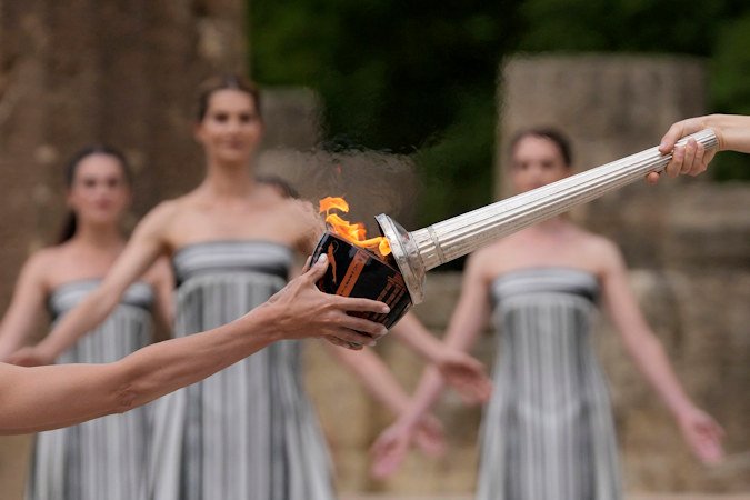 The flame will be carried through Greece for 11 days before being handed over to Paris organizers on April 26.