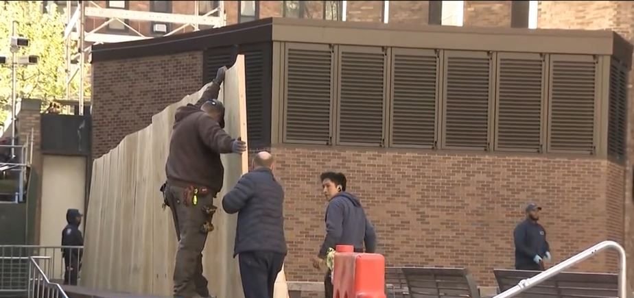 <i>WCBS via CNN Newsource</i><br/>A plywood wall now blocks NYU's Gould Plaza after police arrested several protesters