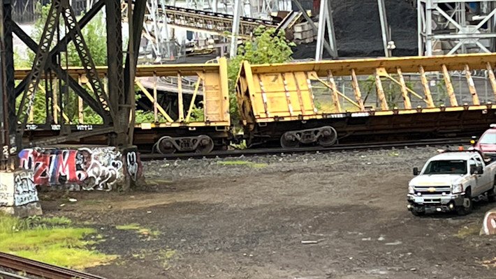 Five empty freight cars derailed Monday morning on the lower deck of Portland's Steel Bridge