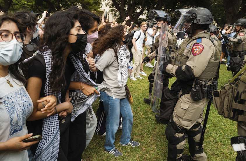 Demonstrators and Texas State Troopers stand off during a pro-Palestinian protest at the University of Texas in Austin on Wednesday.