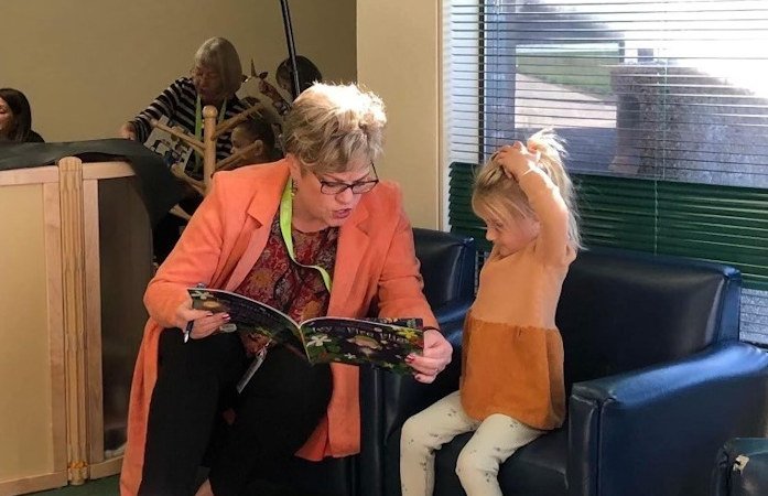 Mid Oregon Branch Manager Lara Eckstine volunteers as a reading buddy with the One-to-One SMART program in Sisters.