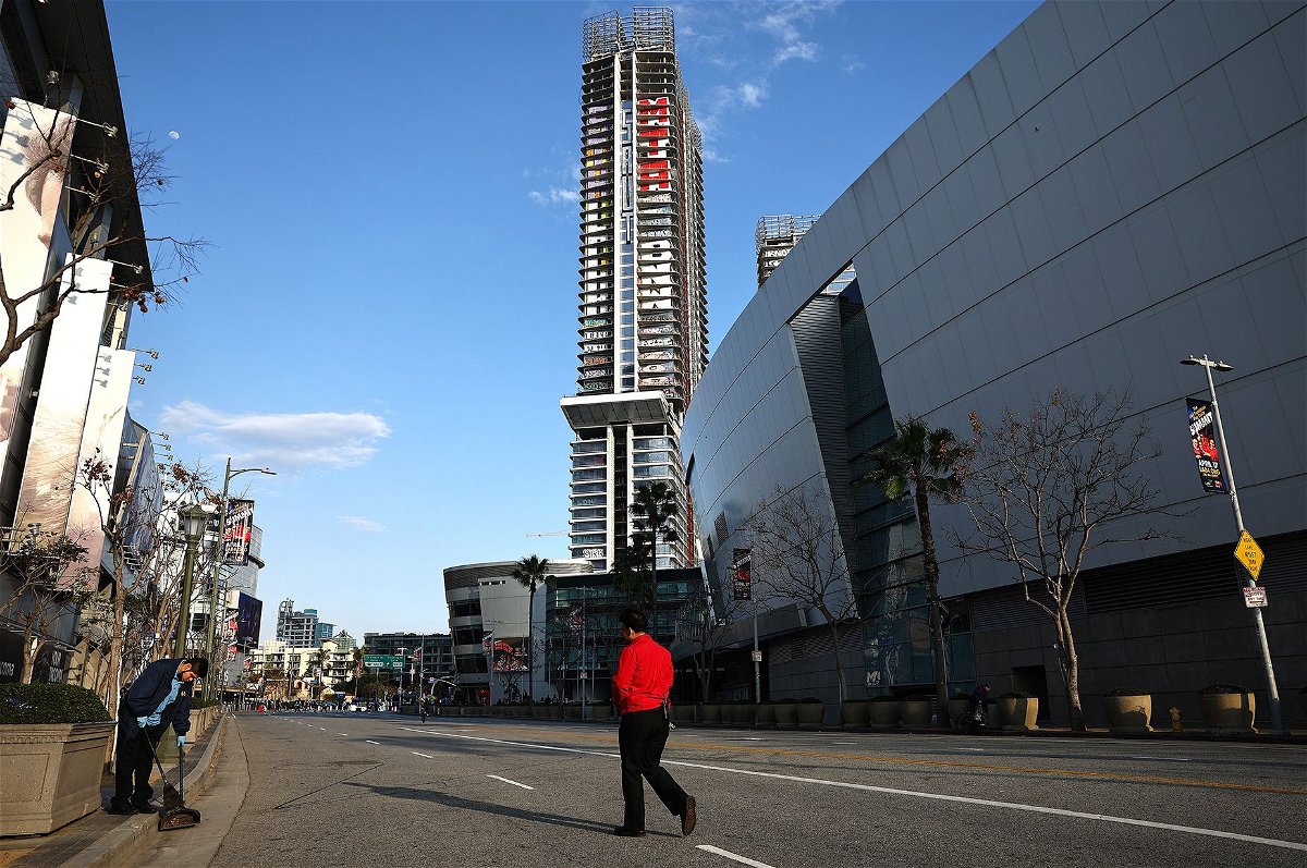 <i>Mario Tama/Getty Images via CNN Newsource</i><br/>Multi-floor graffiti tags and slogans are visible on one of the three high-rise buildings at Oceanwide Plaza on March 20. Such is the prominence of the artwork that the Plaza has become known as 