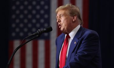 Former President Donald Trump speaks to guests at a rally on April 02