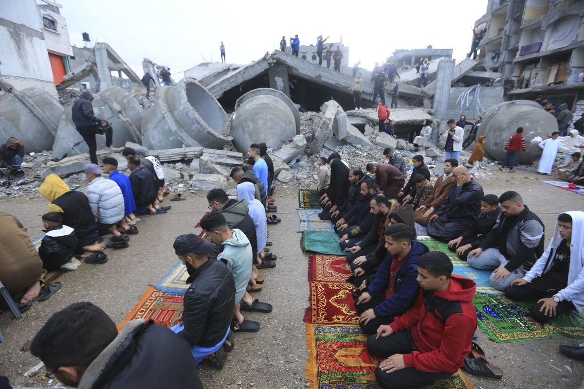 <i>AFP/Getty Images via CNN Newsource</i><br/>Palestinians gather at Gaza City's damaged Omari Mosque during Eid.