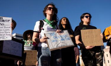 Protesters take part in a rally in Tucson