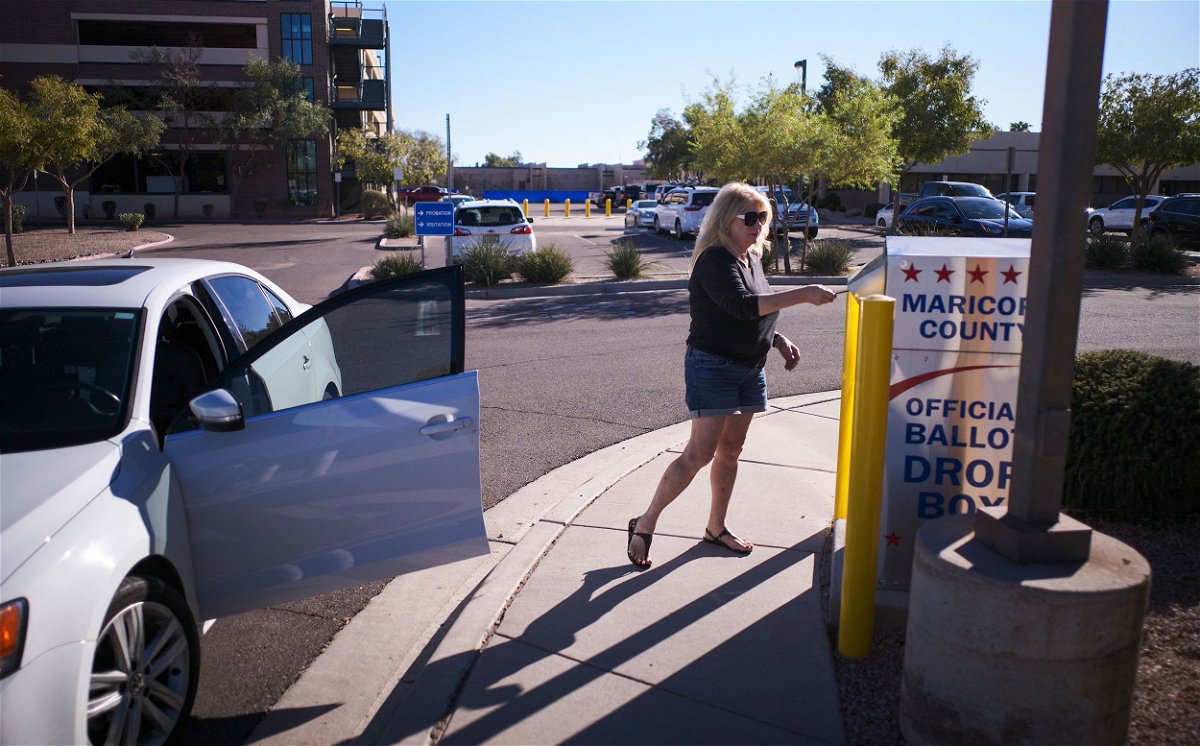 <i>Olivier Touron/AFP/Getty Images via CNN Newsource</i><br/>A woman drops her ballot for the upcoming midterm elections in the drop box near the Maricopa County Juvenile Court Center in Mesa