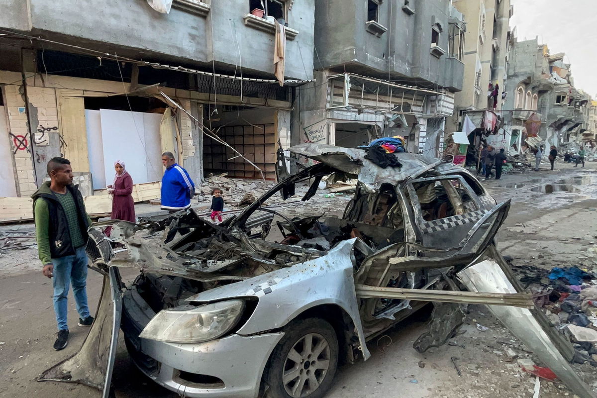 <i>AFP/Getty Images via CNN Newsource</i><br/>People look at the car in which three sons of Hamas leader Ismail Haniyeh were killed in an Israeli air strike near Al Shati