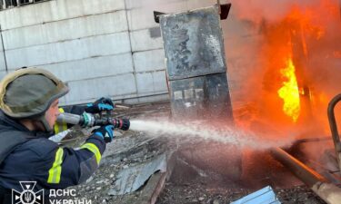 A firefighter tackles a blaze after a Russian attack on a power station at an undisclosed location in Ukraine on April 11.