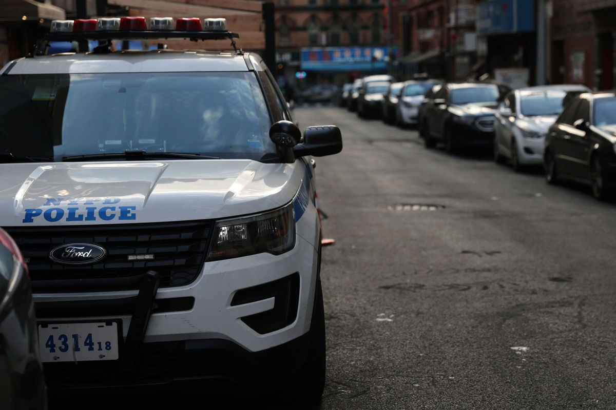 <i>Spencer Platt/Getty Images/File via CNN Newsource</i><br/>A police car drives through Manhattan on January 14