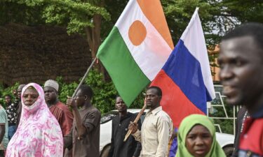 Supporters of Niger's National Council for Safeguard of the Homeland (CNSP) hold up Niger's national flag and the national flag of Russia at the General Seyni Kountche stadium in Niamey in Agust 2023.