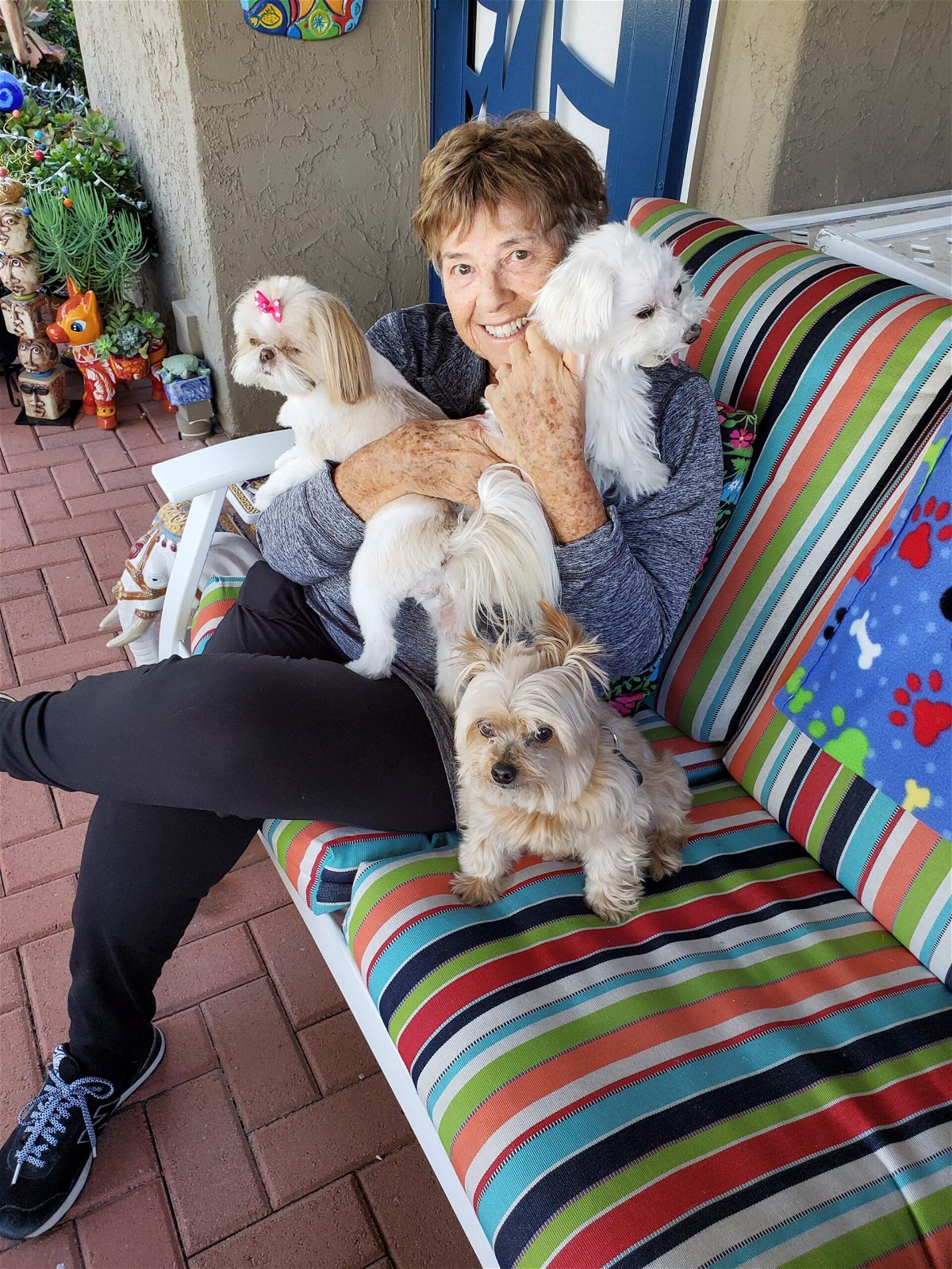 <i>Courtesy Hope Murray via CNN Newsource</i><br/>Hope Murray sits with some furry friends in San Diego
