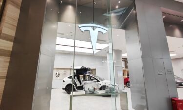 Models of the new energy vehicle series are being displayed at a Tesla store in Shanghai
