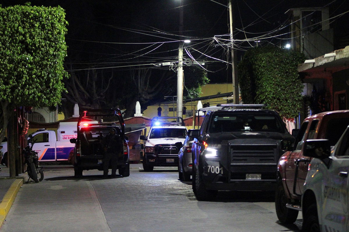 <i>Juan Moreno/Reuters via CNN Newsource</i><br/>Security forces are pictured at the scene of the assassination of Bertha Gisela Gaytán